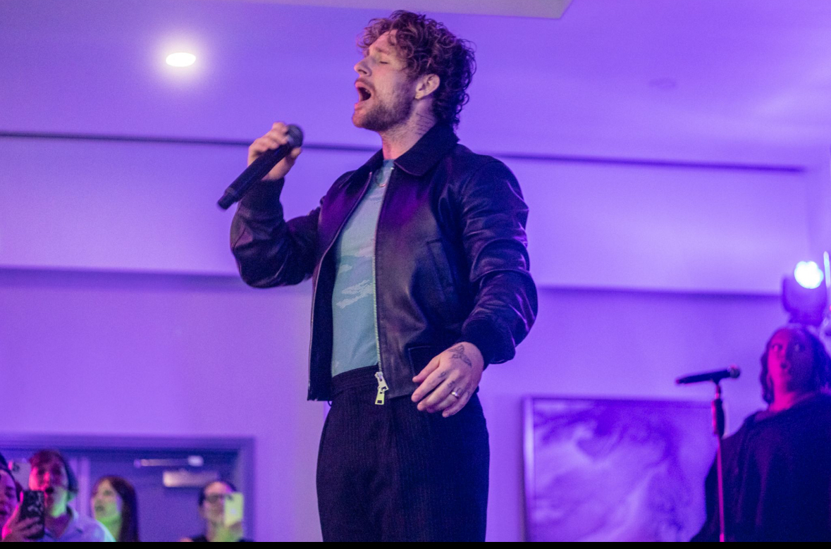Performer using a wireless microphone on stage