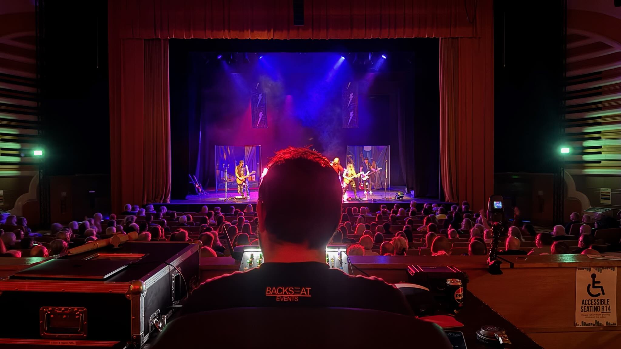 Backseat Events technician working at the sound desk
